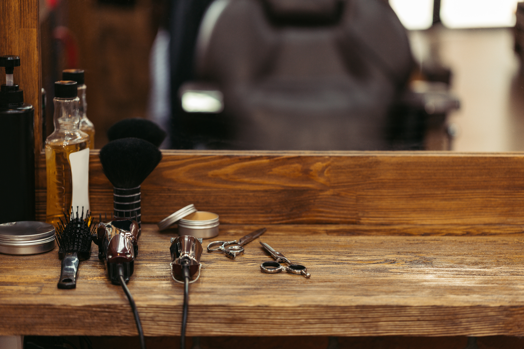 barber tools on wooden shelf and mirror in barbershop | Mr Who Barber Shop
